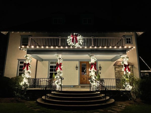 Professional Christmas light installation in Ridgefield CT with illuminated columns, wreath and roofline